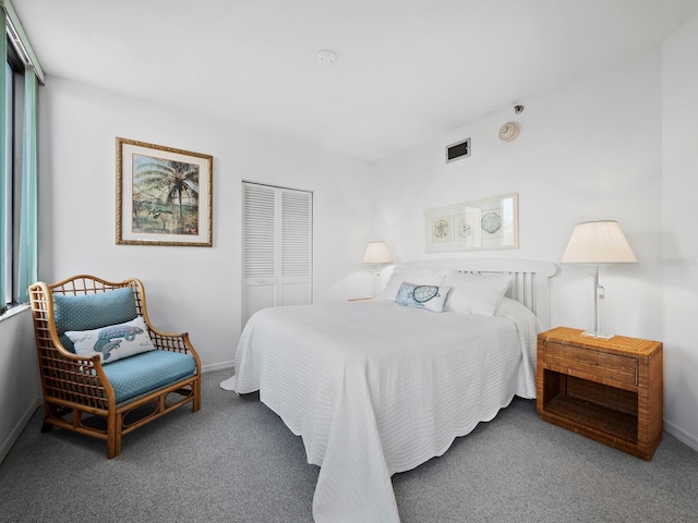 carpeted bedroom featuring a closet