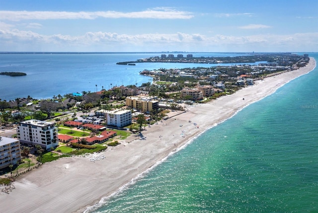 birds eye view of property with a view of the beach and a water view