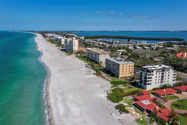 bird's eye view featuring a view of the beach and a water view