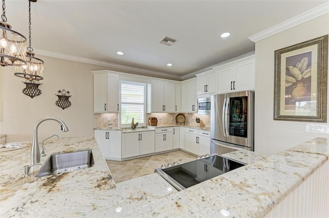 kitchen featuring pendant lighting, white cabinets, crown molding, sink, and appliances with stainless steel finishes