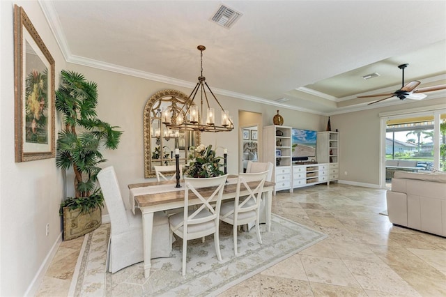 dining room with ceiling fan with notable chandelier, a raised ceiling, and crown molding