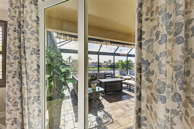 doorway with a healthy amount of sunlight and a textured ceiling