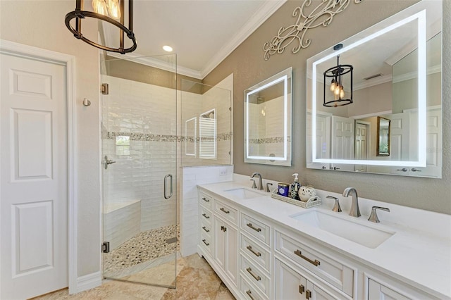 bathroom featuring vanity, an enclosed shower, ornamental molding, and a chandelier