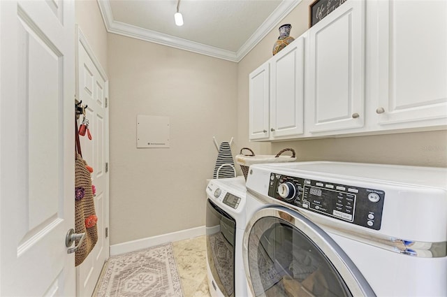 laundry room featuring cabinets, separate washer and dryer, crown molding, and light tile patterned floors