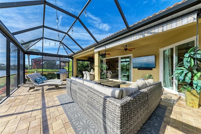 view of patio / terrace with an outdoor hangout area, area for grilling, and a lanai