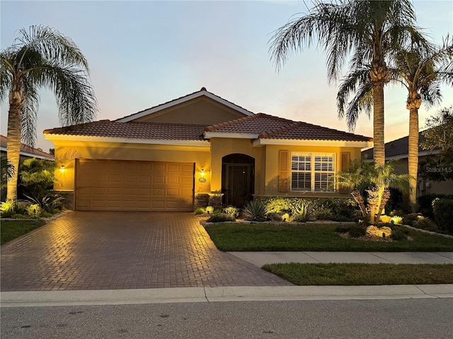 mediterranean / spanish-style home featuring a garage