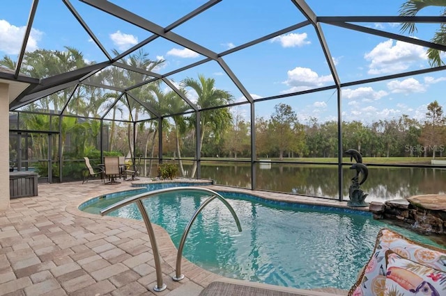 view of pool featuring a patio, a water view, and glass enclosure