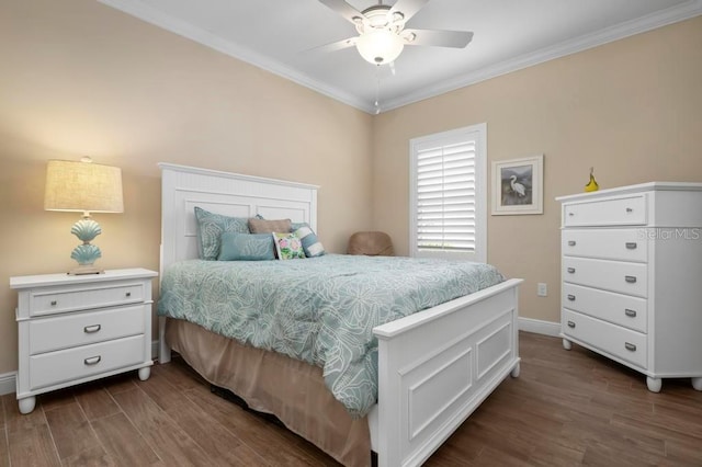 bedroom featuring ceiling fan, dark hardwood / wood-style floors, and crown molding