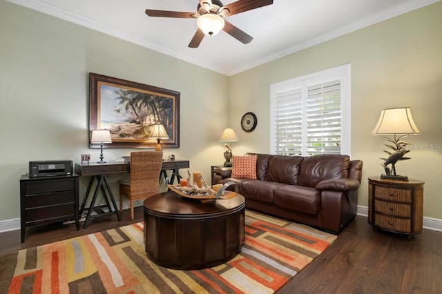 living room with dark hardwood / wood-style flooring, ceiling fan, and crown molding