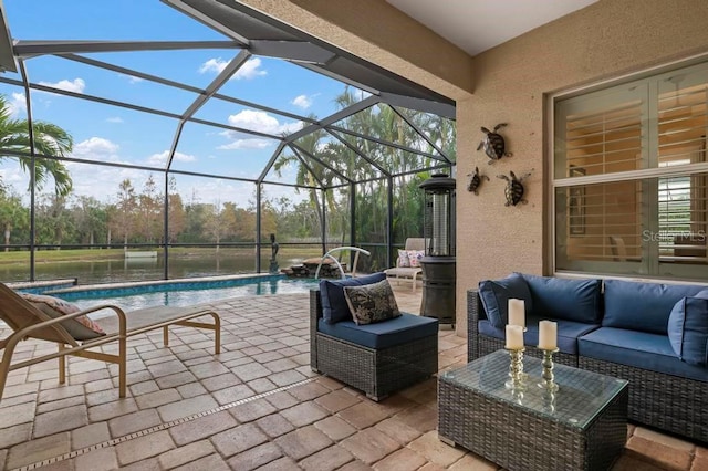 view of patio / terrace featuring glass enclosure, pool water feature, and an outdoor hangout area