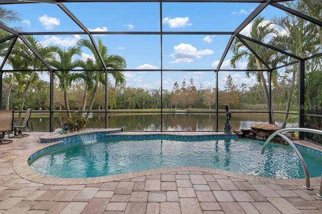 view of pool featuring a lanai, a patio area, pool water feature, and a water view