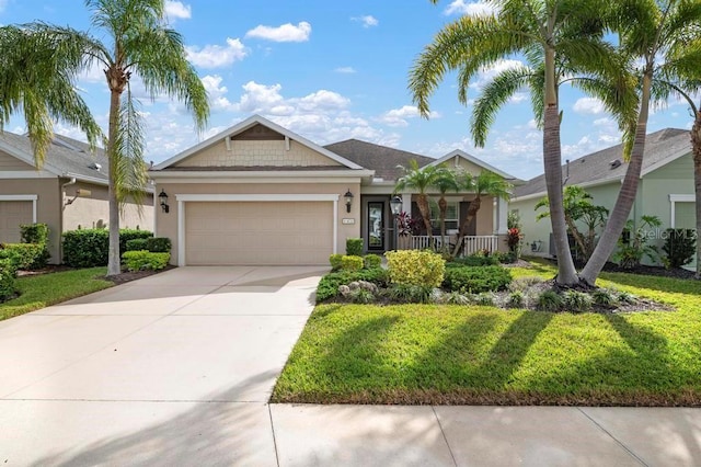 view of front of property with a front lawn, a porch, and a garage