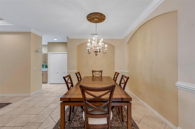 tiled dining space featuring crown molding and an inviting chandelier