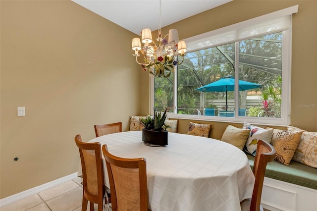 dining room featuring light tile patterned floors and a chandelier