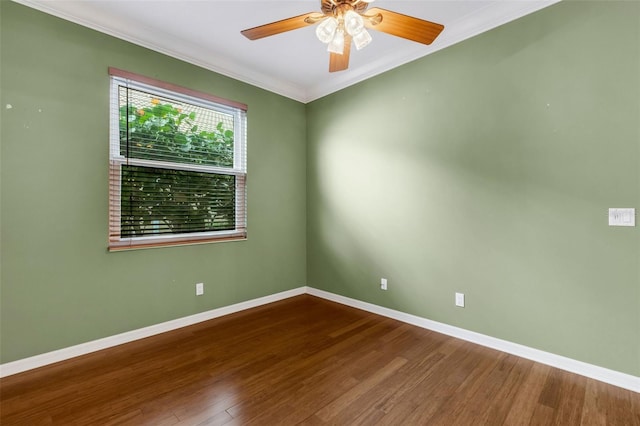 empty room featuring hardwood / wood-style flooring, ceiling fan, and ornamental molding