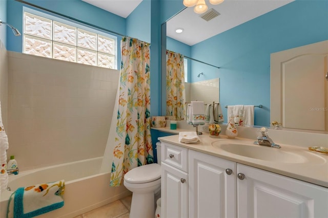 full bathroom with toilet, shower / tub combo, vanity, and tile patterned floors