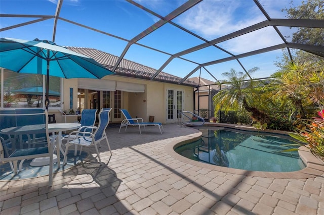 view of pool featuring a patio area, french doors, and glass enclosure