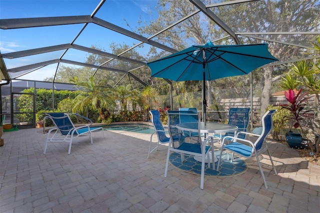 view of patio / terrace featuring glass enclosure