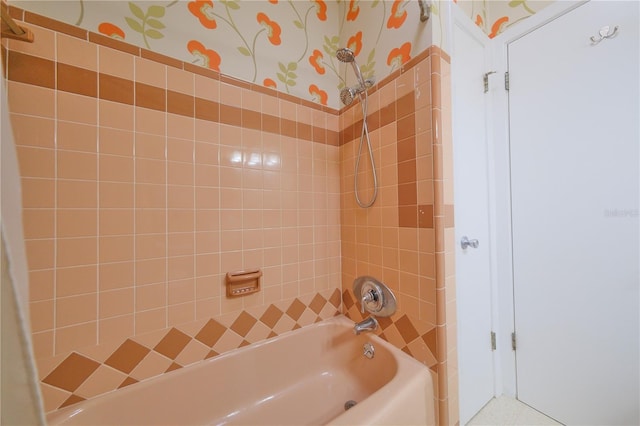 full bathroom with washtub / shower combination and wallpapered walls