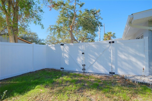 view of yard with a gate and fence