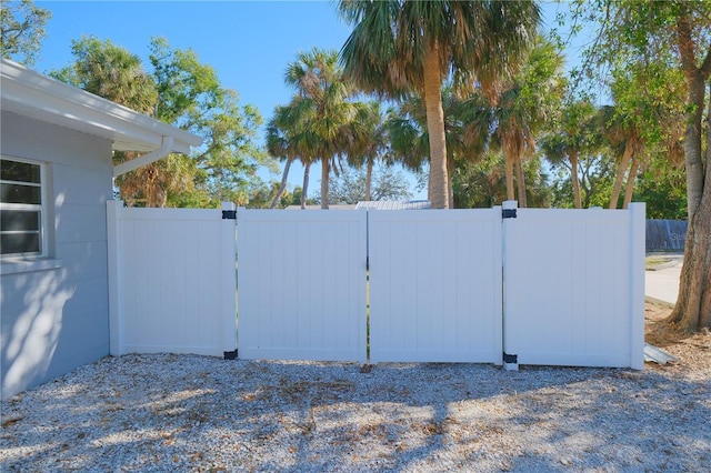 view of gate with fence