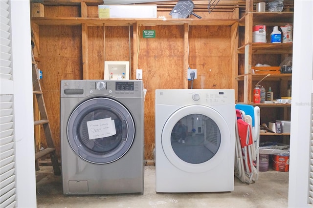 laundry area featuring washing machine and clothes dryer