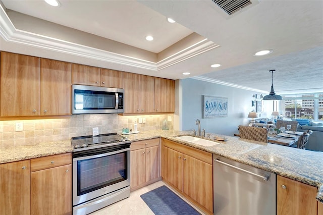 kitchen with light stone countertops, sink, stainless steel appliances, kitchen peninsula, and light tile patterned floors