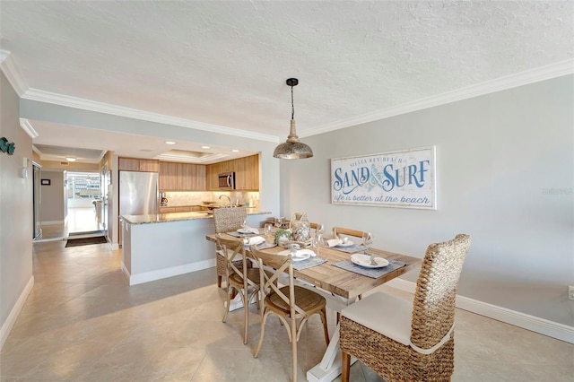 dining space featuring ornamental molding, light tile patterned floors, and a tray ceiling