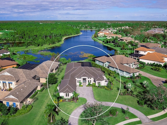 birds eye view of property with a water view