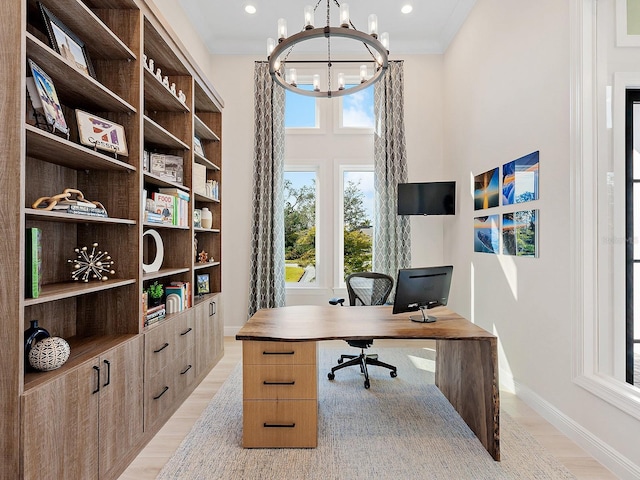 office area featuring a notable chandelier, light hardwood / wood-style floors, and crown molding