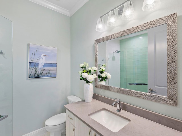 bathroom with walk in shower, toilet, vanity, and ornamental molding