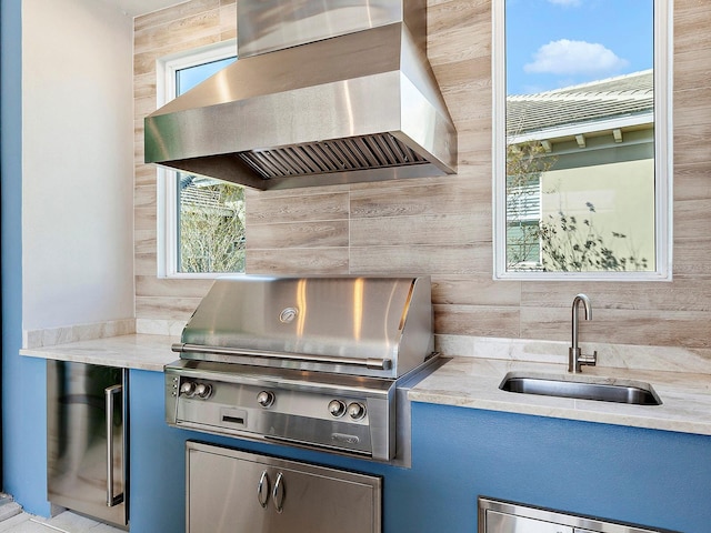 view of patio / terrace with a grill and sink