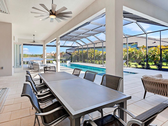 view of patio / terrace with ceiling fan and a lanai