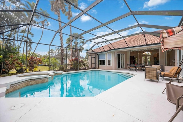 view of pool with a patio area, outdoor lounge area, glass enclosure, and an in ground hot tub