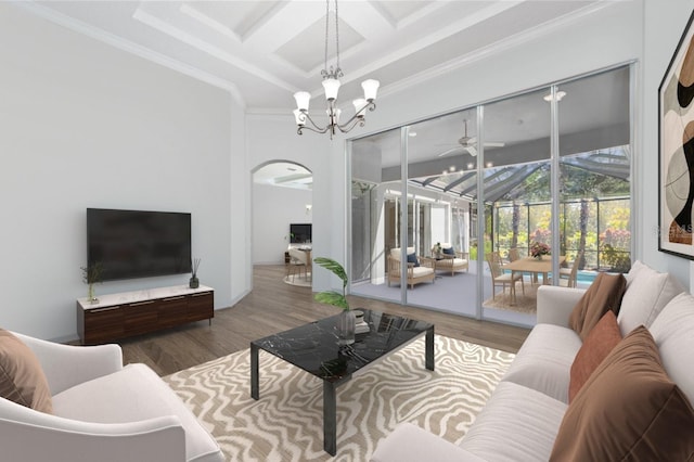 living room featuring ornamental molding, wood-type flooring, and coffered ceiling