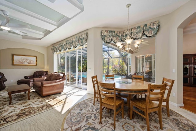 dining space with light tile patterned flooring and a chandelier