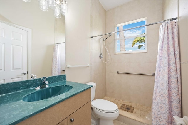 bathroom featuring toilet, a shower with curtain, and vanity