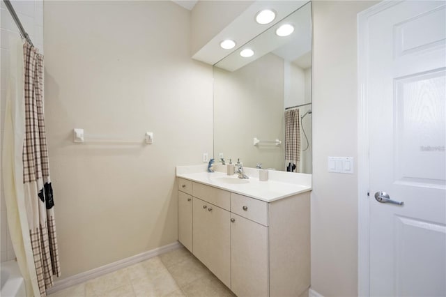 bathroom with vanity and shower / bath combo with shower curtain