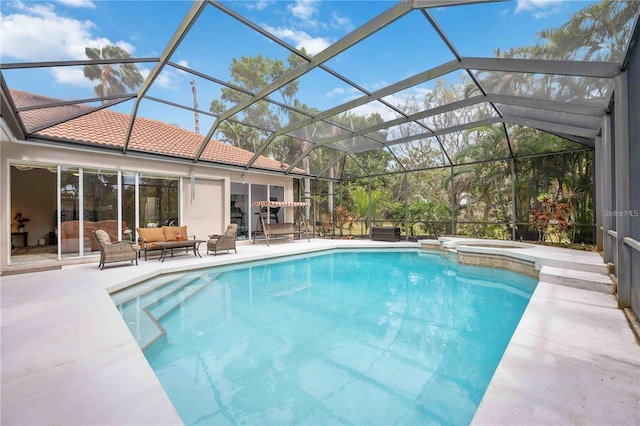 view of swimming pool with a lanai, an outdoor living space, a patio area, and an in ground hot tub