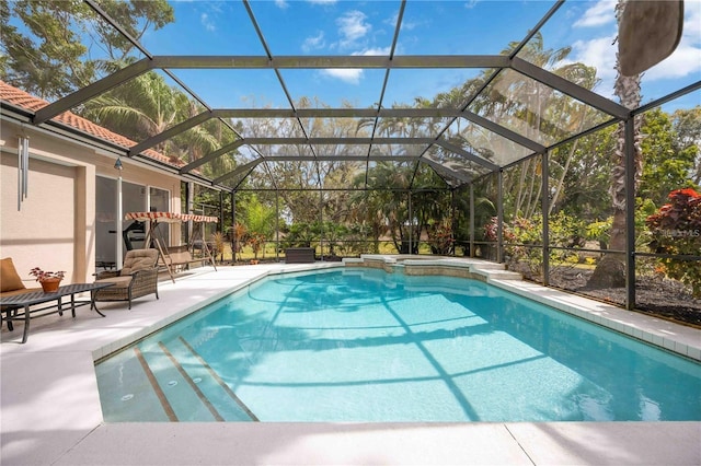 view of pool featuring a lanai and a patio