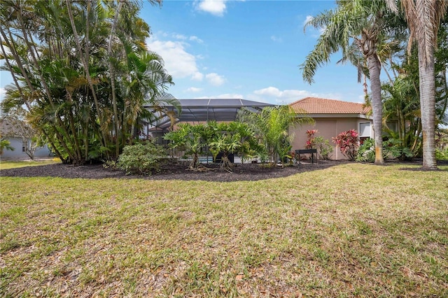 view of yard featuring a lanai