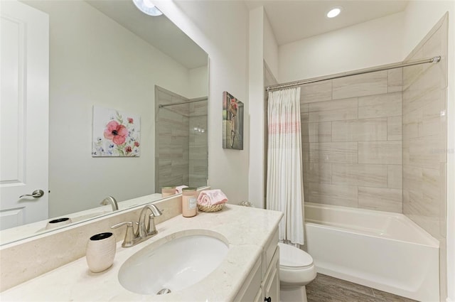 full bathroom featuring vanity, toilet, and shower / bath combo