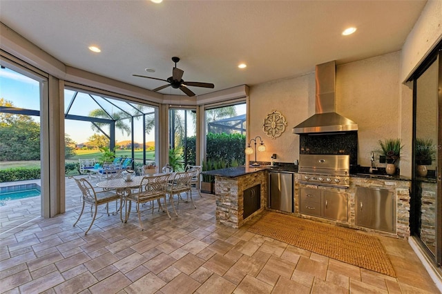 exterior space with area for grilling, ceiling fan, a lanai, and a grill