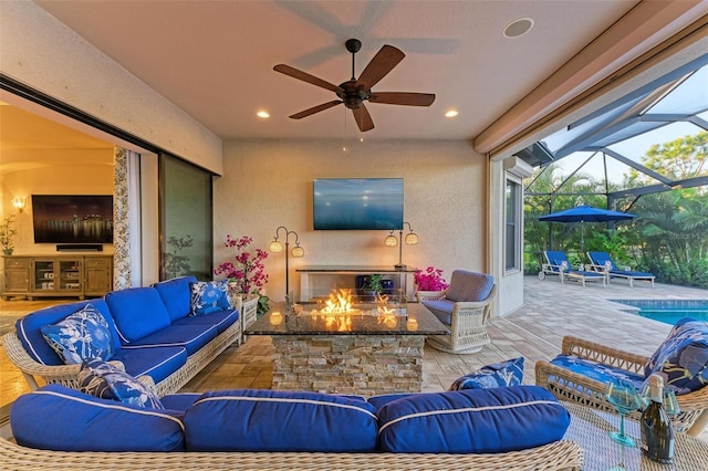 view of patio / terrace featuring an outdoor hangout area, ceiling fan, and a lanai