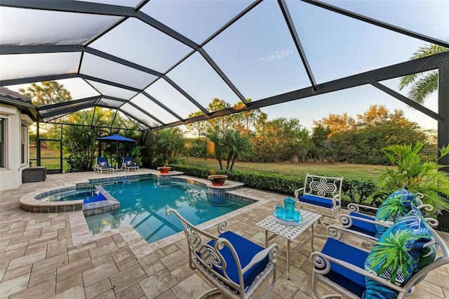 view of pool featuring a lanai, an in ground hot tub, and a patio