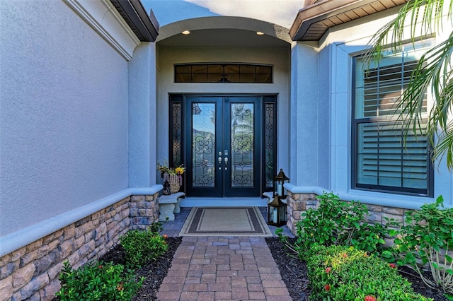 property entrance featuring french doors