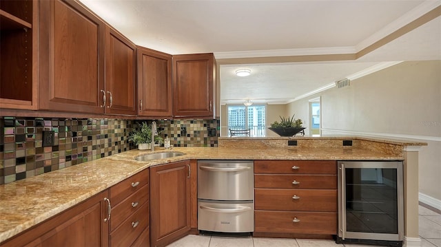 kitchen featuring wine cooler, sink, light stone counters, and light tile patterned flooring