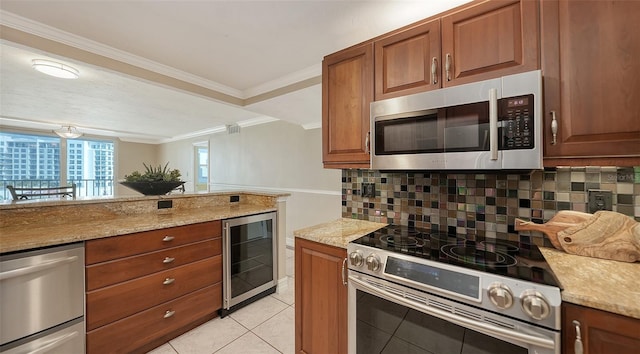 kitchen featuring wine cooler, light tile patterned flooring, appliances with stainless steel finishes, light stone countertops, and backsplash