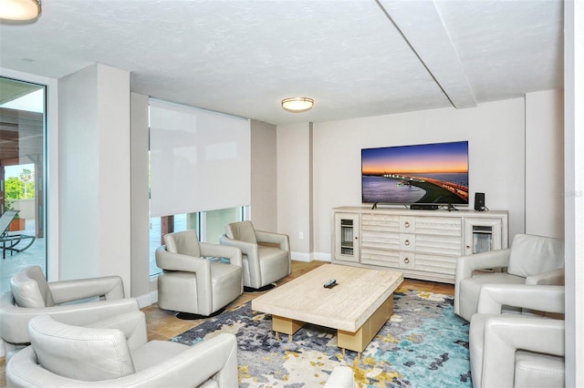 living room featuring a textured ceiling and a wealth of natural light