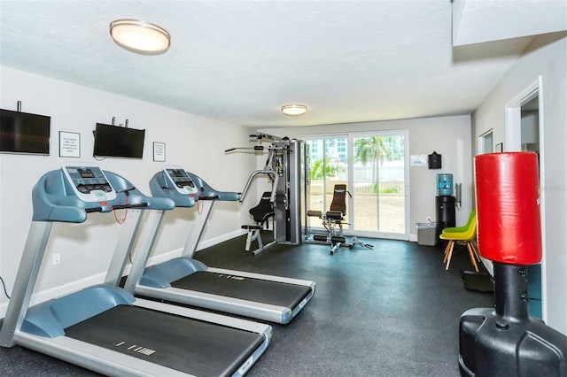 workout room with a textured ceiling